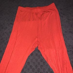 Orange leggings, they do fit taller heights never been worn